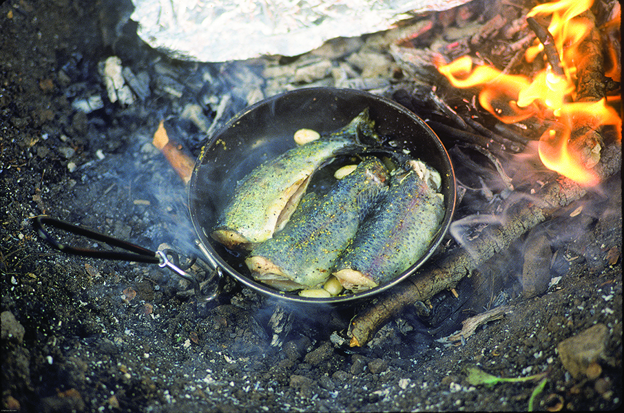 fish cooking trout outside bozeman