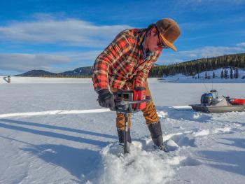 drilling ice fishing hole hyalite