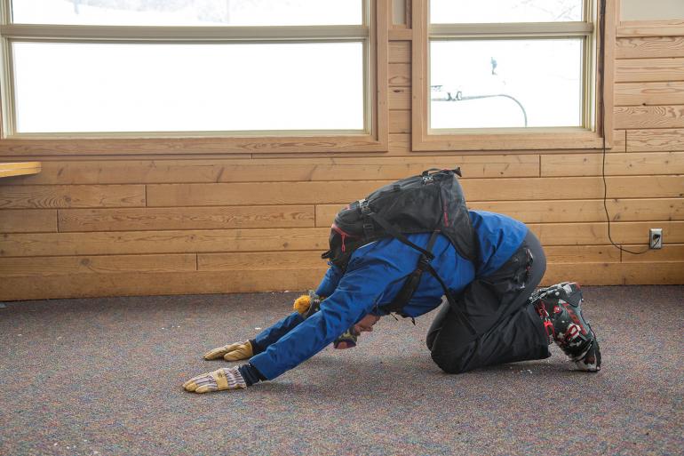 Ski pregame stretch child's pose