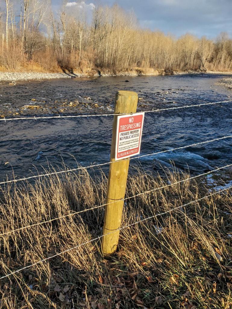 Illegal sign on riverbank