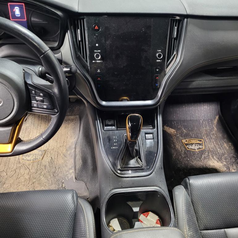 Dirty interior of a vehicle before being serviced by SwissDetail