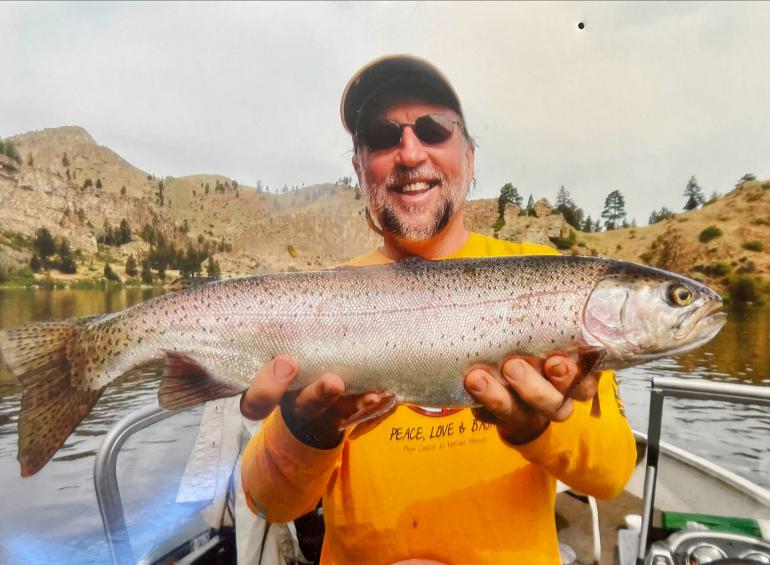 Parks Reece holds a trout on the Missouri river