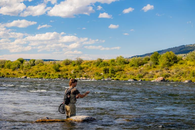 Fisherman using the cripple mayfly dry