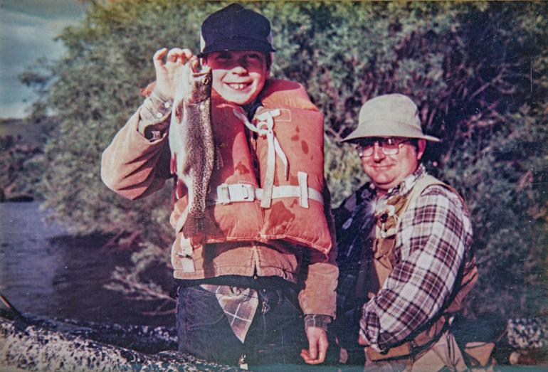 A boy catches his first Montana trout
