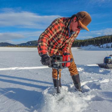 drilling ice fishing hole hyalite