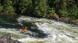 Running a rapid in a ducky, rafting