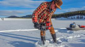 drilling ice fishing hole hyalite