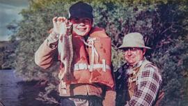 A boy catches his first Montana trout