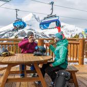 Skiing apres beer drinking on patio
