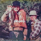 A boy catches his first Montana trout